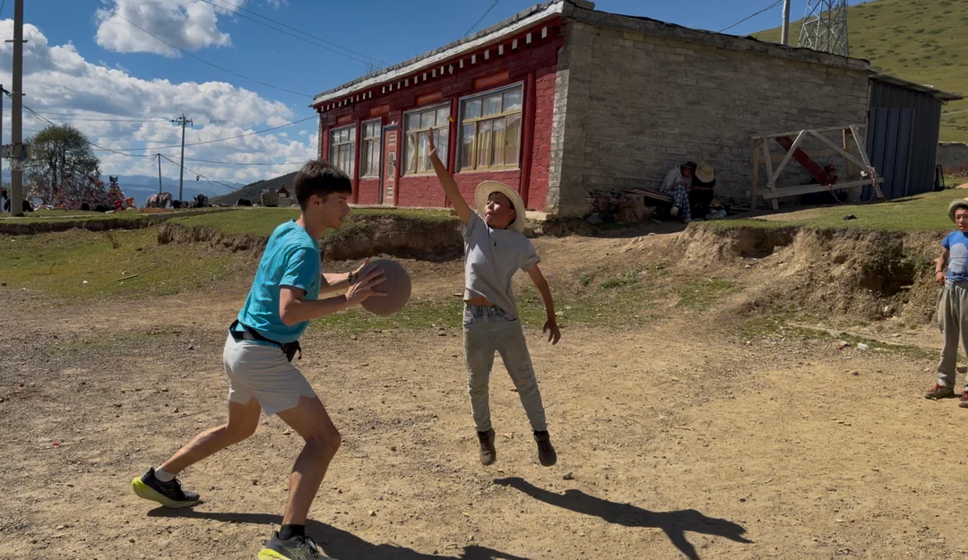 A drive towards the basket during an impromptu grassland game