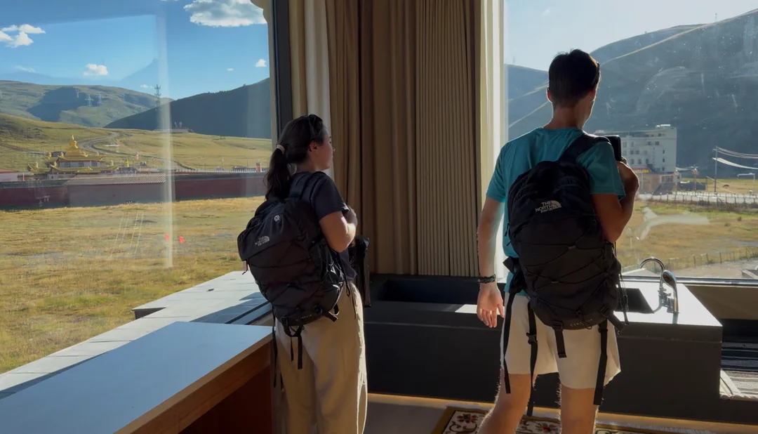 Eva and Martin beside the window of our grassland accommodation