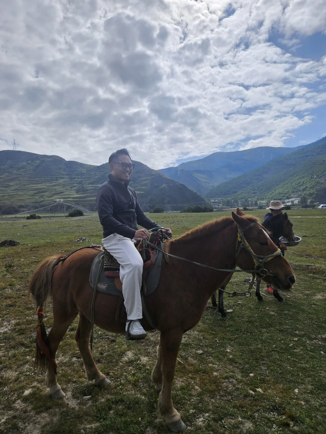 Ryan riding a horse on the grassland