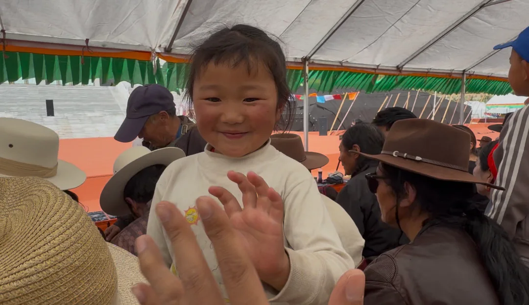 Sharing a moment with a local girl at the celebration