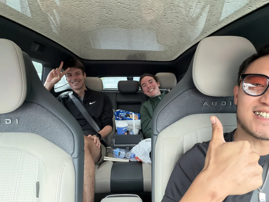 Ryan, Eva and Martin taking a photo together in the car after returning to Chengdu