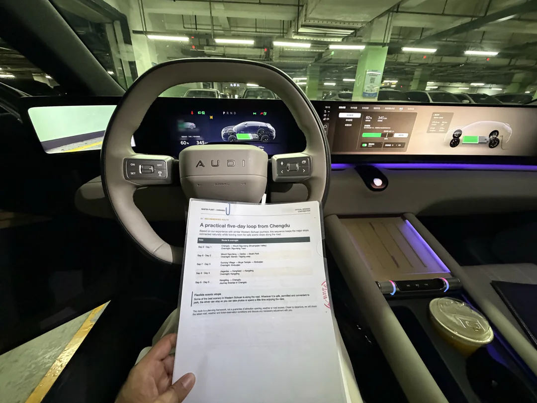 The car beside the formal booking document, with the guests’ names redacted